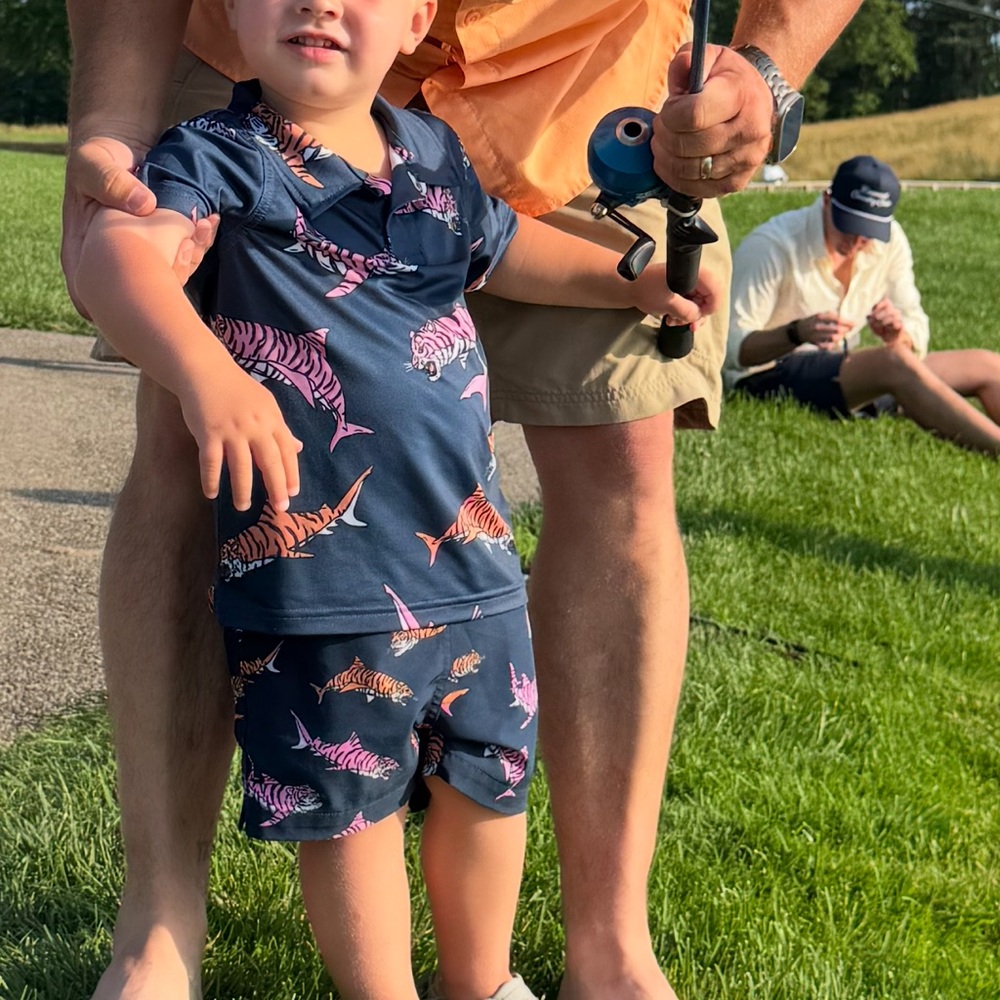 Chubbies Kids Navy Shark Swim Trunks and matching performance fabric polo